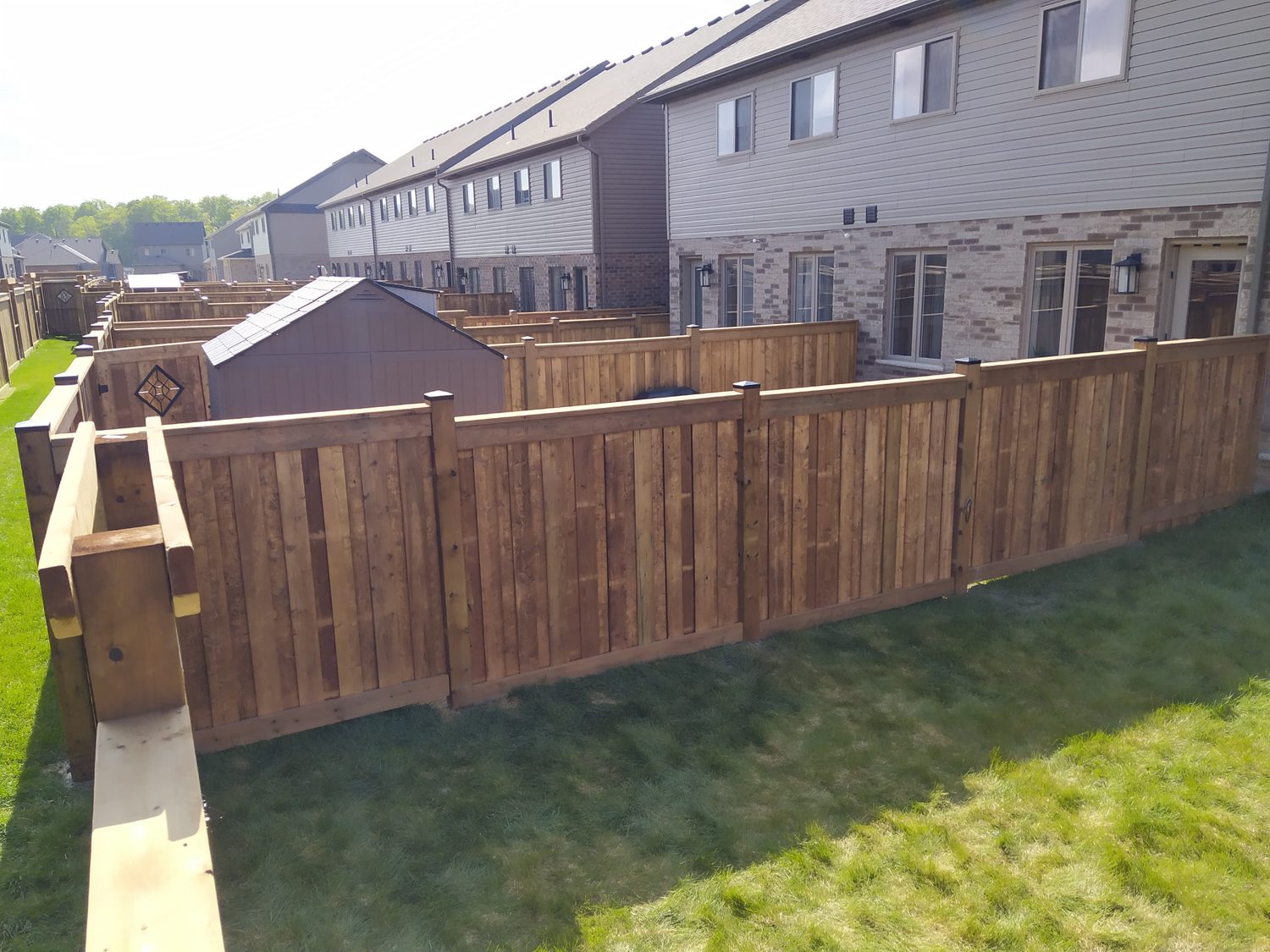 A long run of new board on board privacy fence
